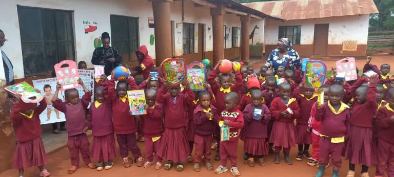 Kindergarteners with new supplies and toys